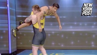 Mark Consuelos strips down to wrestling singlet, gets slammed into the ground on Live With Kelly