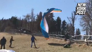 Ghost-like wind slams paraglider into fence and tree